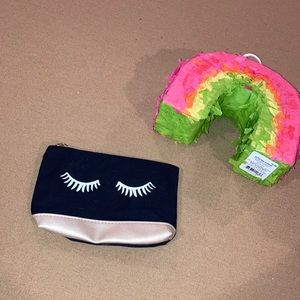 Black and silver Ipsy cosmetic bag
